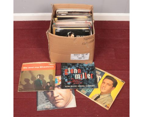 A box of LP records. Includes Elvis, Buddy Holly, Meat Loaf etc.  