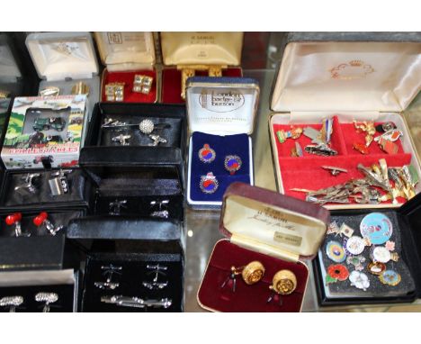 A shelf full of costume jewellery, badges, cufflinks &amp; other 