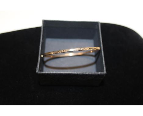 A 9ct gold bangle 