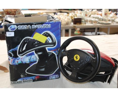 Two vintage gaming controls including Sega Saturn 