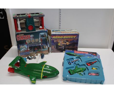 A box of vintage Sting Ray and Thunderbirds toys etc 