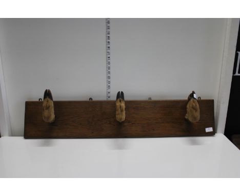 A vintage deer foot &amp; oak gun rack collection only 