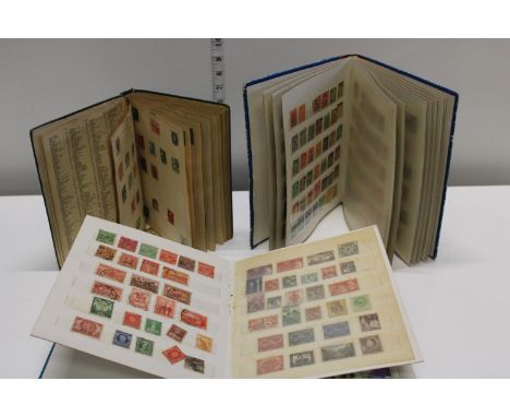 Three vintage stamp albums 