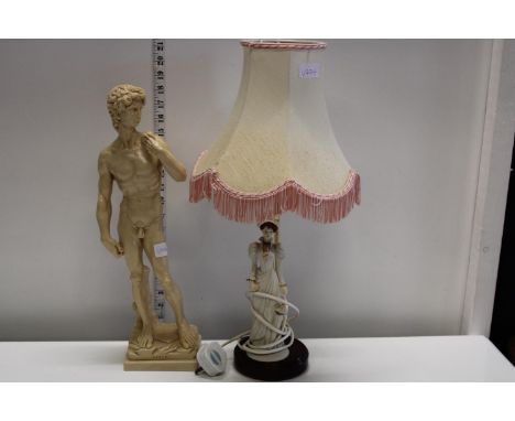 A resin statue of David and a vintage table lamp 