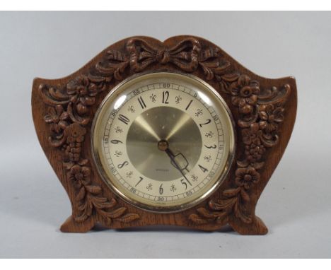 A Westclox Mantle Clock in Carved Wooden Frame
