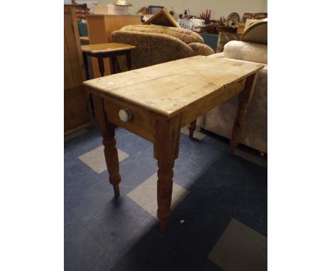 A Pine Kitchen Table with Single Drawer and Ceramic Handle 