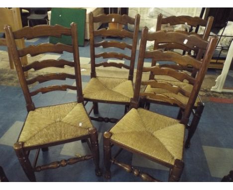 A Set of Four Rush Seated Ladder Back Dining Chairs