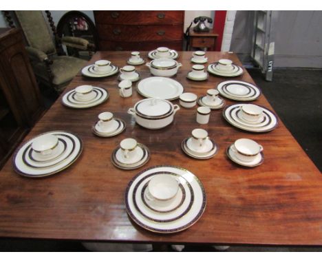 A Royal Worcester "Mountbatten" part tea and dinner service comprising eight dinner plates, serving plate, tureens, soup bowl