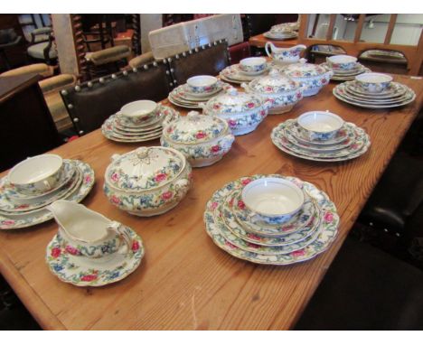 A large collection of Booths Floradora dinnerware including five vegetable tureens, meat dishes, jugs, soup cups etc. 