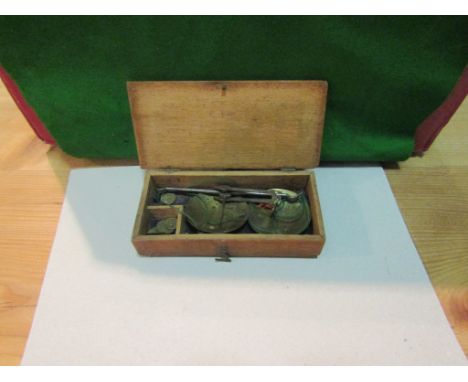 A small mahogany cased set of fine balance scales with weights, 15cm long