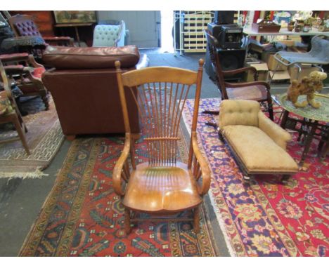 A 19th Century elm bentwood stickback chair with low seat, on stretcher base with scroll arms 