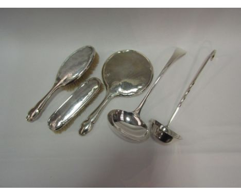 A silver dressing table set, mirror and two brushes, Samuel L Levi, Birmingham assay, together with a Bravington silver plate