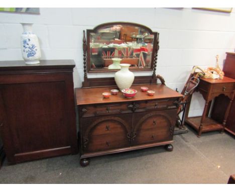 Circa 1920 an oak dressing chest of three drawers with barley twist mirror supports over turned feet, 143cm x 110cm x 48cm