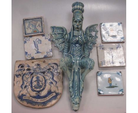 together with a winged 'beast' wall candlestick and a ceramic armorial (6)