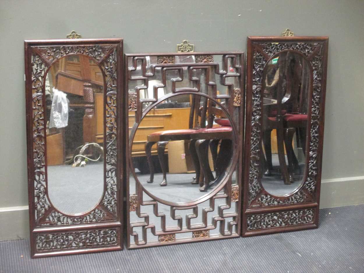 Three rectangular Chinese carved wall mirrors, 80 x 50cm and 87 x 37cm (pair) in Cheffins Fine Art
