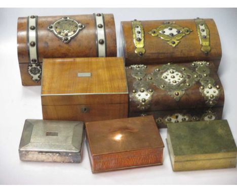 A collection of three walnut and brass bound caddy boxes together with a group of metal cigarette boxes and a small silver ph