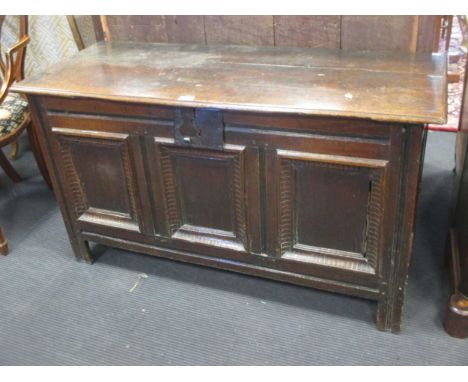 An early 18th century oak coffer, the three fielded moulded panel front on channelled stiles, 66 x 124 x 50cm