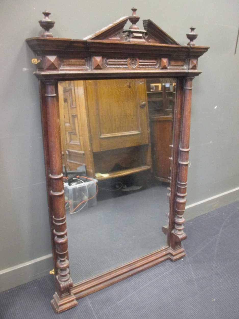 A carved oak overmantle mirror, in Cheffins Fine Art