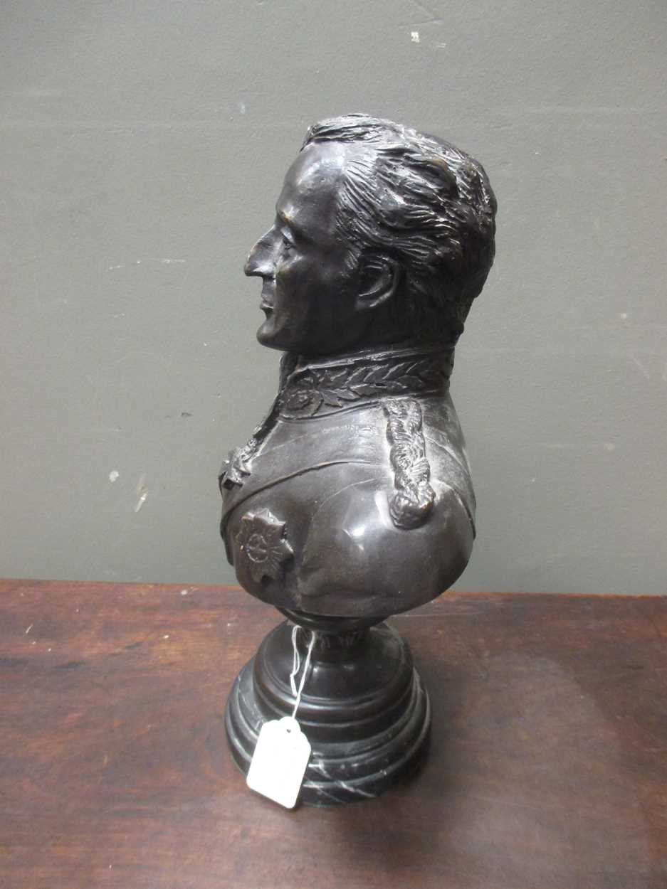 A reproduction bronze bust of the Duke of Wellington on integral socle