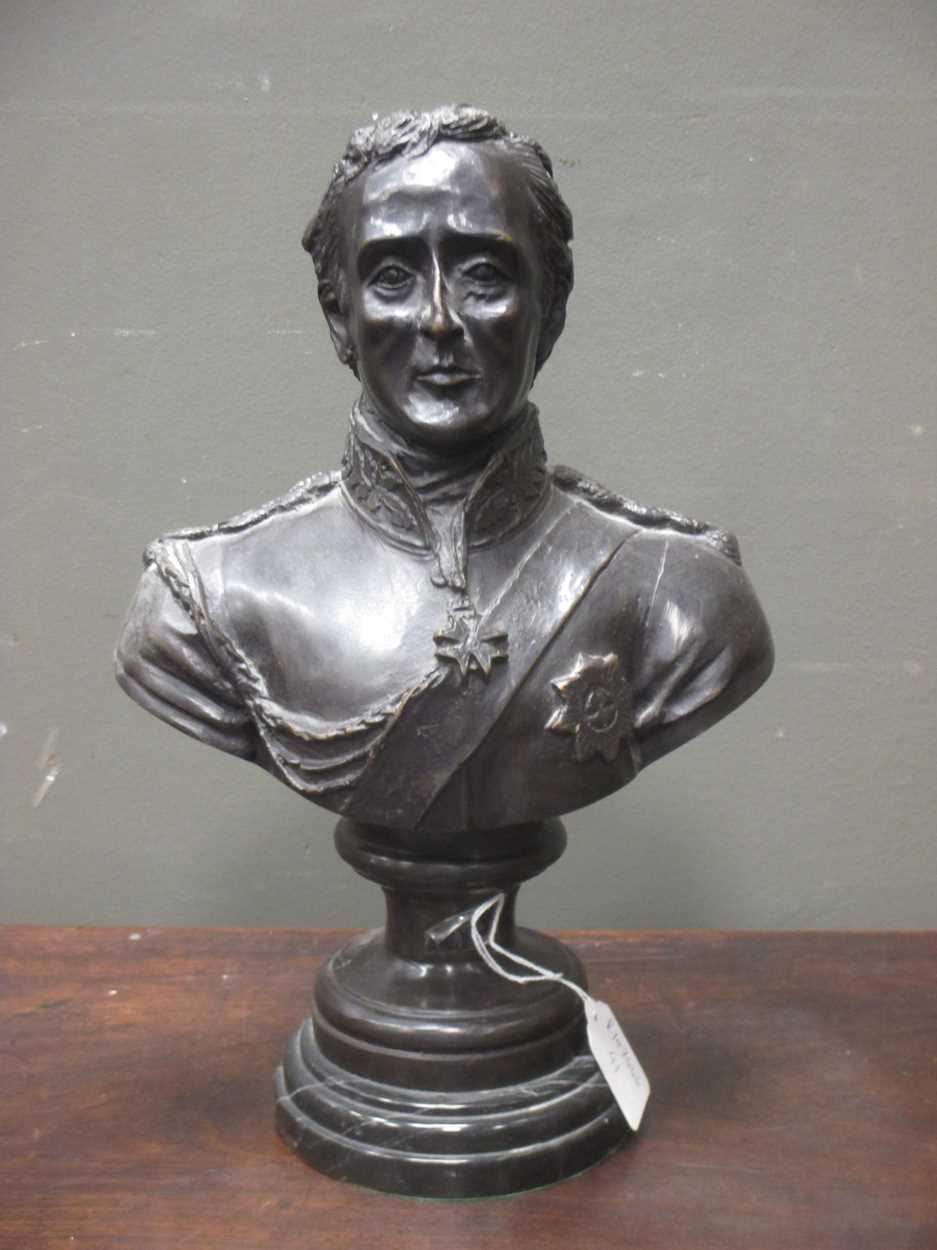 A reproduction bronze bust of the Duke of Wellington on integral socle