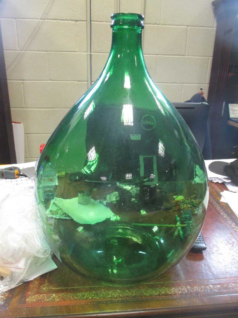 Four green glass brewing bottles, 64cm high (4) in Cheffins Fine Art