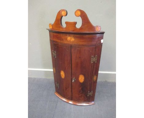 Edwardian inlaid mahogany bow front corner cupboard with swan neck pediment and key 90cm high