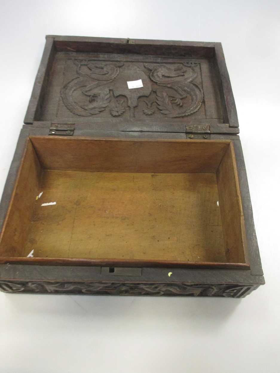 A Chinese/Far Eastern relief carved hardwood box in Cheffins Fine Art