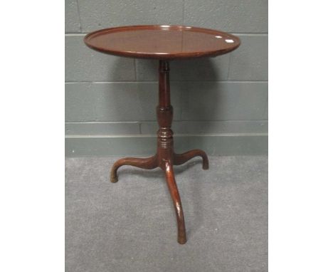 A mahogany circular tip top table on tripod base, 52cm