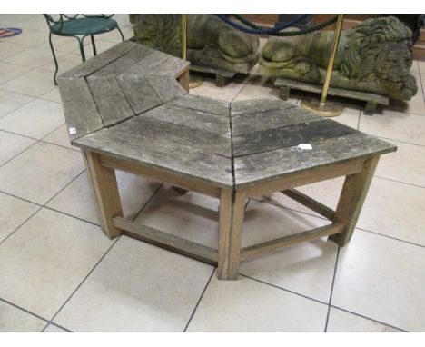 A semicircular convex garden bench to fit around the trunk of a tree 164cm wide, internal width 53cm