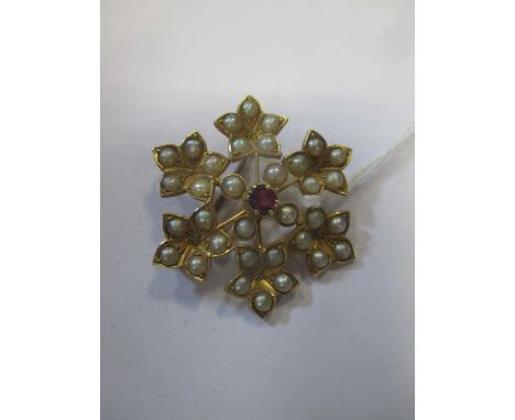 Edwardian six leaf 15ct gold brooch set with pearls centred by a ruby within 4 pearls, stamped '15ct', 6.08g