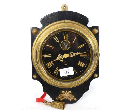 A brass-cased circular dial bulkhead clock, height 28cm, not currently working 