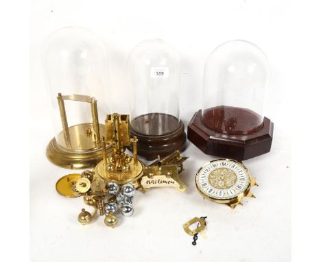 3 glass domes and bases, with clock parts, largest overall height 29cm 