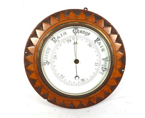 An oak starburst cased wall barometer, diameter 25cm 
