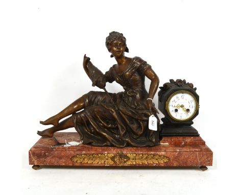 A large Art Nouveau figural spelter and pink marble mantel clock, by Itsweire-Tournade of Hazebrough, with movement striking 