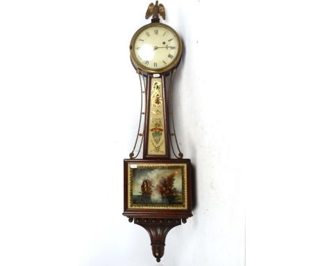 An ornate wall clock, with glazed panels surmounted by an eagle, height 106cm 