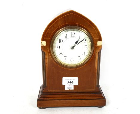 A French Art Nouveau mahogany lancet-top mantel clock, case height 24cm, working order, with key 