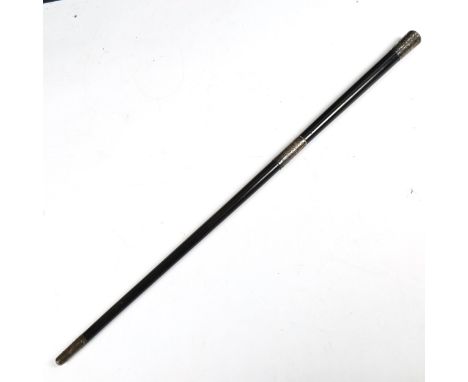 An early 20th century silver-mounted ebony swagger stick, engraved foliate decoration, hallmarks London 1902, length 48cm 