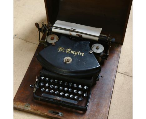 A Vintage Empire typewriter, in wood carrying case 