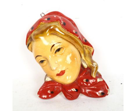 An Art Deco painted plaster wall mask, height 22cm 