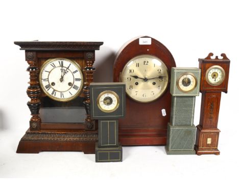A German oak 8-day lancet-top mantel clock, silvered dial with Arabic numerals, and movement striking on a gong, case height 