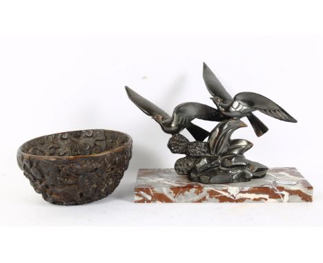 An Art Deco style spelter bird sculpture, signed Limousin, and an Oriental resin 'Dragon' bowl, diameter 15cm (2) 