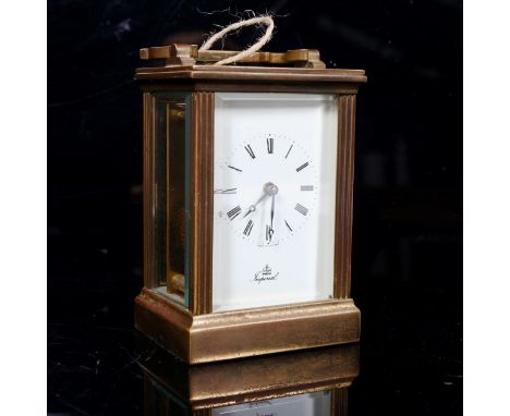 An Imperial brass-cased carriage clock, by Fema, case height 11.5cm, working order, with key 