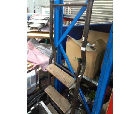 A pair of metal step ladders 