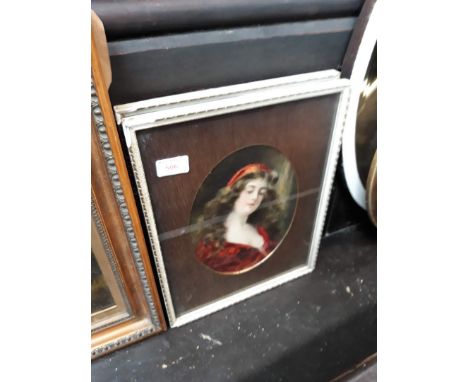A pair of oval portrait prints depicting young ladies, glazed and framed 29cm x 38cm. 