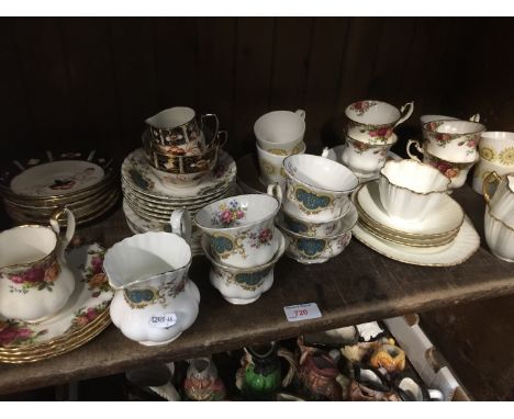 A shelf of mainly cups and suacers including Royal Albert old country roses and Berkley patterns and 8 peices of early porcel