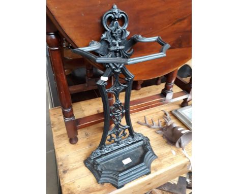 A cast metal stick stand, height 60cm. 