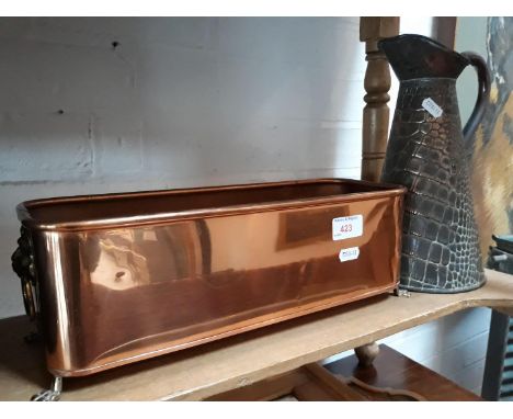 A croc leather effect embossed copper jug and a copper and brass planter. 
