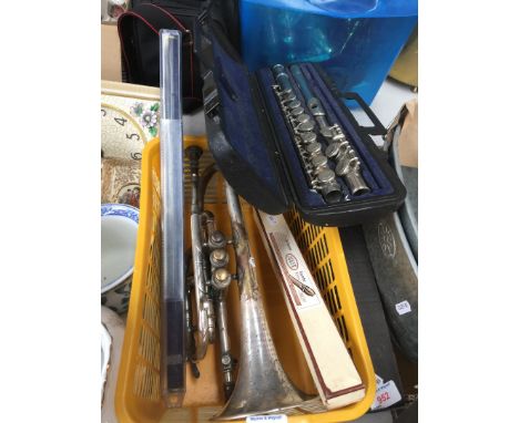 A selection of musical instruments including a silver plated cornet, a silver plated flute, an Adler recorder and a Tony Dixo
