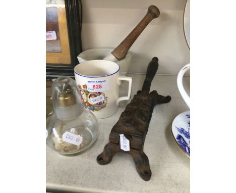 A pestle &amp; mortar, commemorative mug, small glass lamp and cast metal nut cracker 