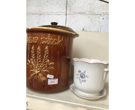 A bread crock and a small planter 